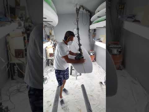 Ruffffff shaping a 9'4" longboard.