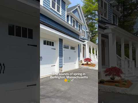 A modern colonial new construction in Burlington, Massachusetts. A beautiful front porch for Spring