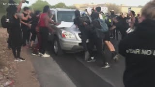 Tense moments erupt as protesters march in Paradise Valley