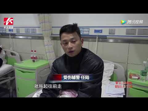 醉汉无证驾驶暴力冲关逃逸，将两名辅警拖行400米