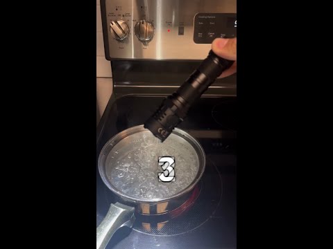 Can this flashlight boil in hot water and still work?!... Let's find out! #shorts