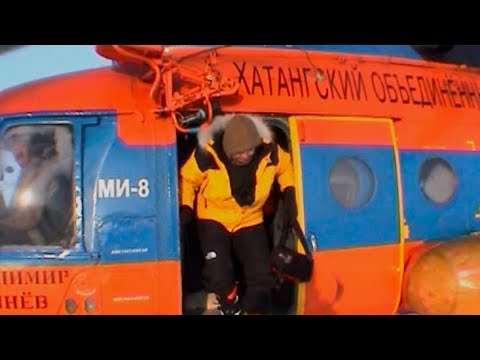 Descending from the helicopter on the icepack - Geographic North Pole 2002 expedition