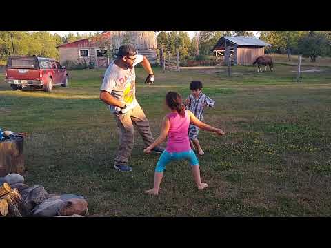 Nick, Lucy, and Jack dancing at the farm