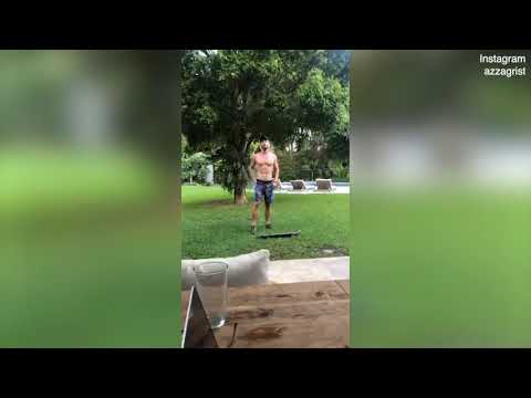 Shirtless Chris Hemsworth attempts skateboard tricks