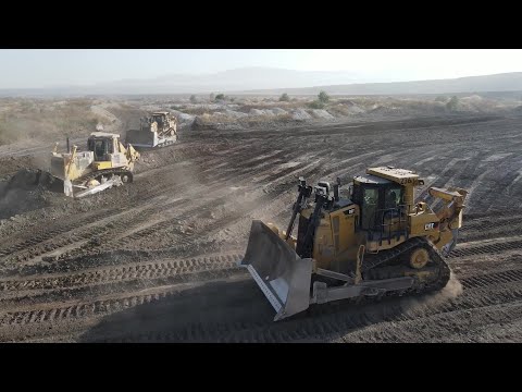 Five Caterpillar D9T And Komatsu D275 Bulldozers In Action - Aerial View