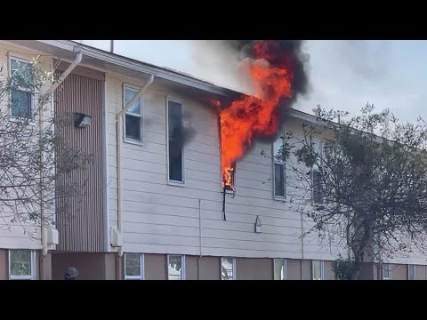 Firefighters fight a blaze at an apartment complex in Victoria