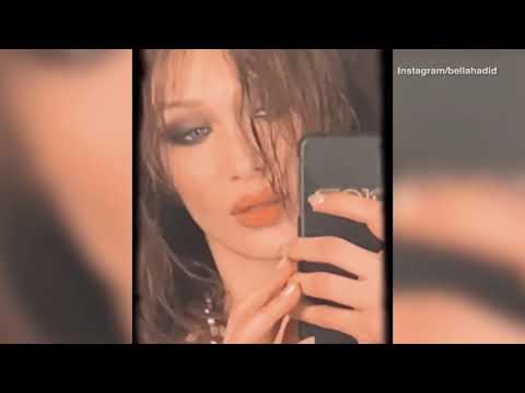 Bella Hadid models dark eye shadow and wet hair for Instagram