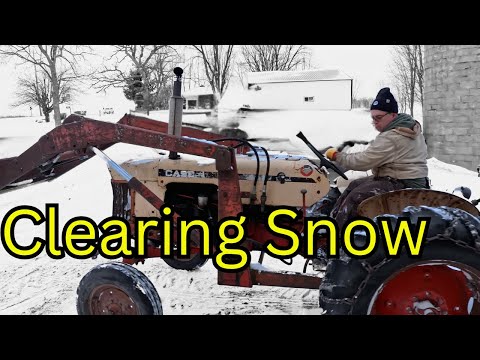 Pushing Snow After First Snowfall on Homestead