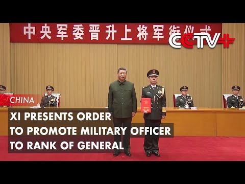 Xi Presents Order to Promote Military Officer to Rank of General