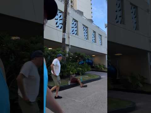 Passing out ice-cold 1.5-liter bottles of water to the homeless on my last day in Honolulu, HI