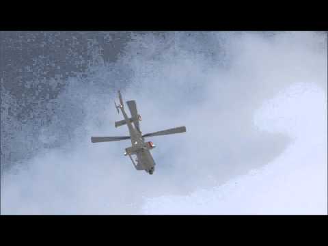 Three news helicopters flying above the accident site