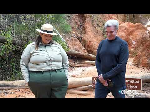 Providence Canyon Park Ranger Reba Bolton explains the oily substance running along the canyon floor