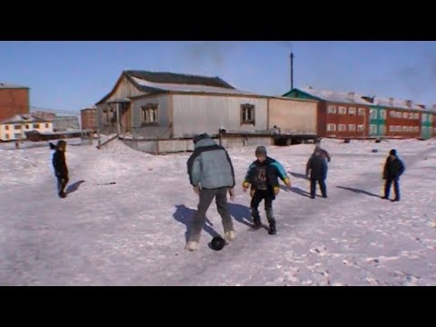 Siberian children playing football in Khatanga - Geographic North Pole 2002 expedition