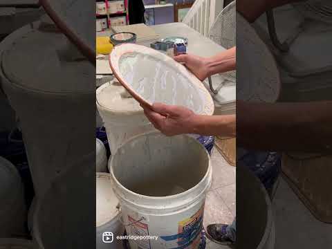 Glazing a plate bottom design with layered Coyote’s TTS oil spot glazes.