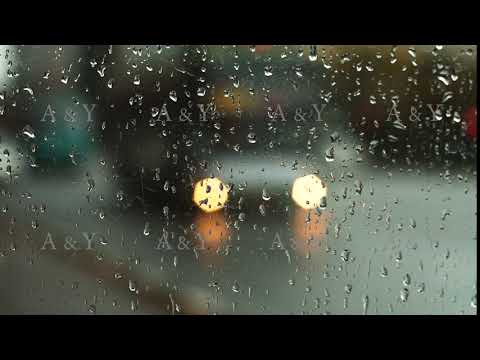 Car lights through wet glass.