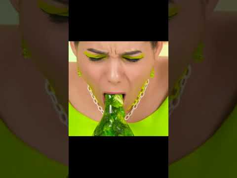 girl drinks green cola