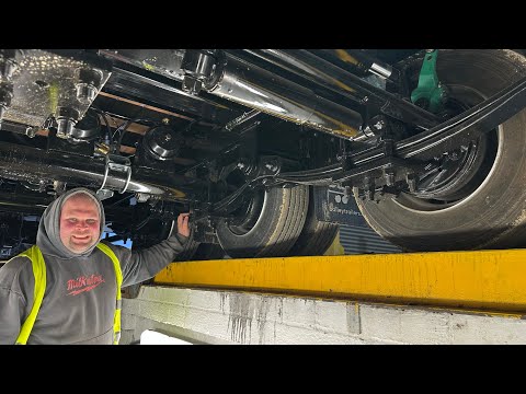 Underneath the low loader trailer / adding a light Machining bolts to make the sprayer work