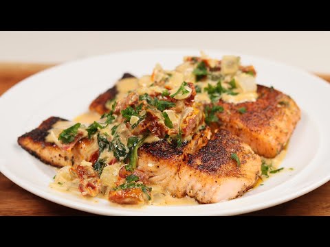 BLACKENED SALMON SMOTHERED IN TUSCAN CREAM SAUCE