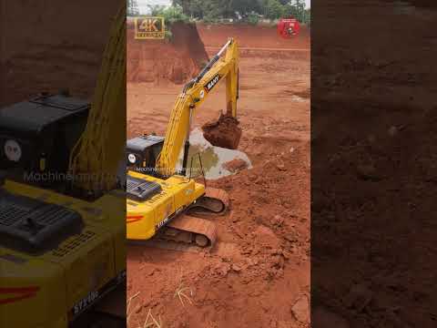 Excellent Moment! Excavator loading dirt into a Truck