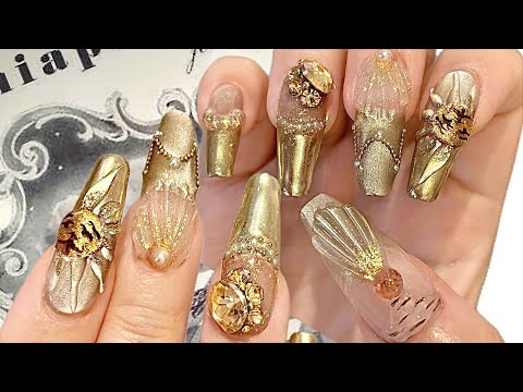 Schiaparelli　gold nails: Inspired by Dali's perfume bottle, the Sun King Art Nouveau gel nail