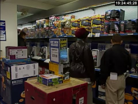 Looking at computers in a CompUSA store in 2000