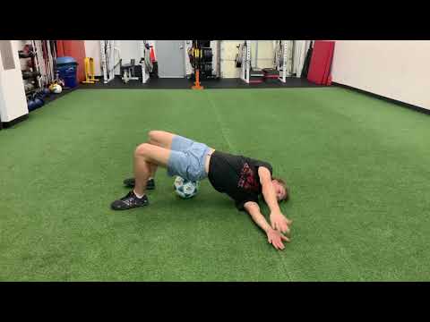 Soccer Glute Bridge with Rotation