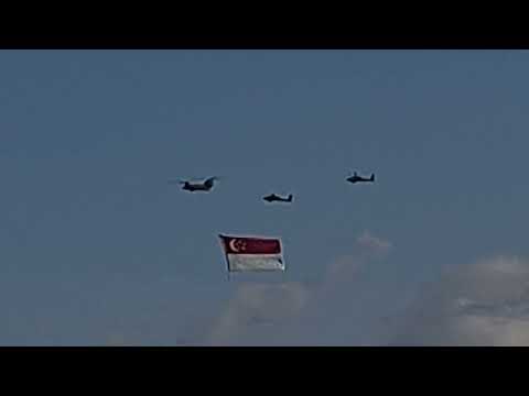 NDP 2023-  Chinook with escort helicopters carrying the Singapore Flag flypast