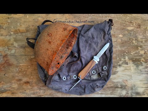 Cleaning the rotten M38 German paratrooper helmet and bag