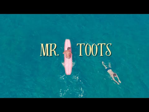 Mr. Toots surfing in Waikīkī | Close up drone footage 4k