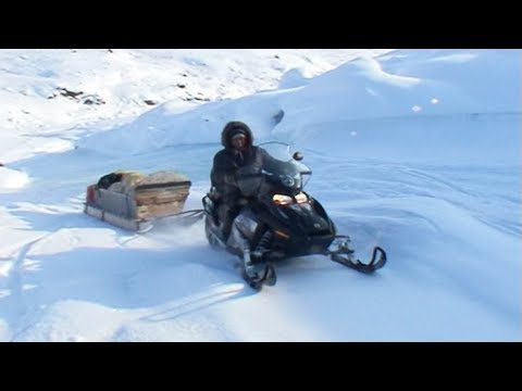 Through the tundra and lakes in snowmobiles towards the icecap Penny - Penny Icecap 2009 expedition