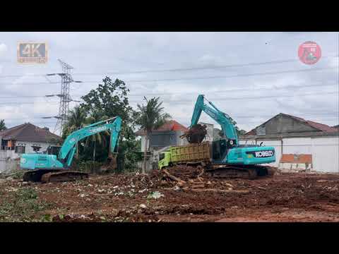 Kobelco SK200 Excavator Loading Dirt and Tree into The Truck