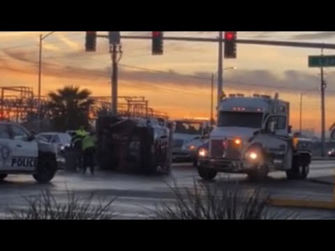 VIDEO: Ambulance lands on its side after east Las Vegas crash