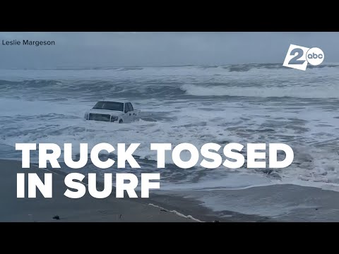 Truck trashed in surf at Pacific City beach