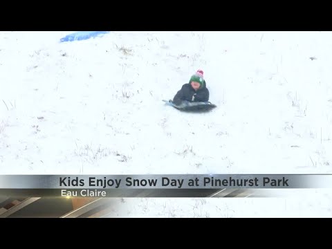 Kids enjoy snow day sledding at Pinehurst Park