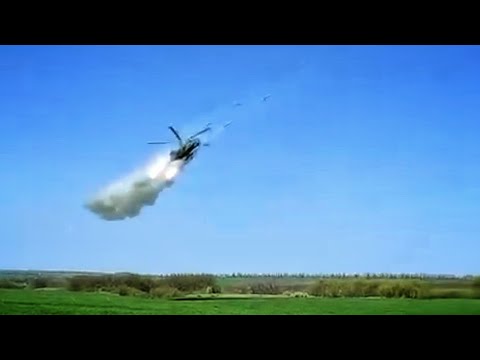 Two Mi-24 firing Rockets in low level.