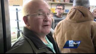 Customers line up to pick prized bird at poultry shop