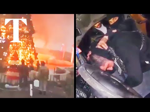 Protests erupt after masked men burn Christmas tree in Syria