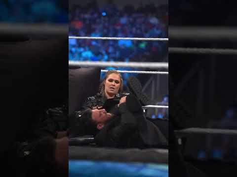 Ronda Rousey locks Drew Gulak between the legs and Adam Pearce nearby during WWE Match Sign #shorts