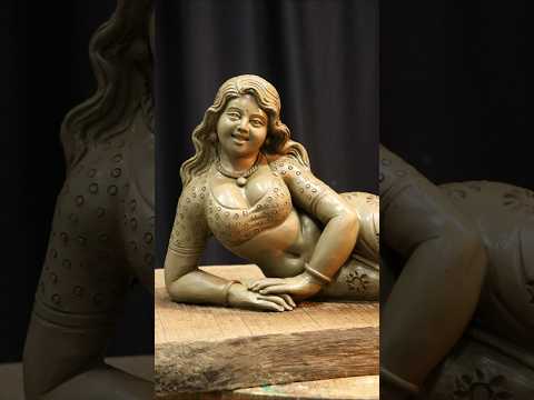 Reverse video of making a clay Lady figure