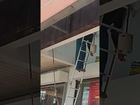 Paint work with single pole ladder