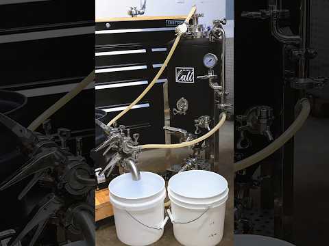 Cleaning beer tanks with a DIY pump cart.