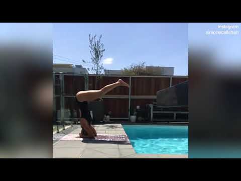 Simone Callahan pulls off impressive headstand by the pool