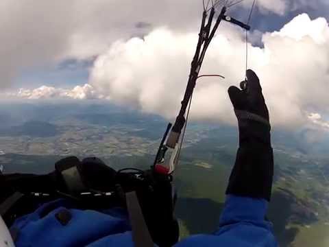 Paragliding  in the clouds above SilverStar