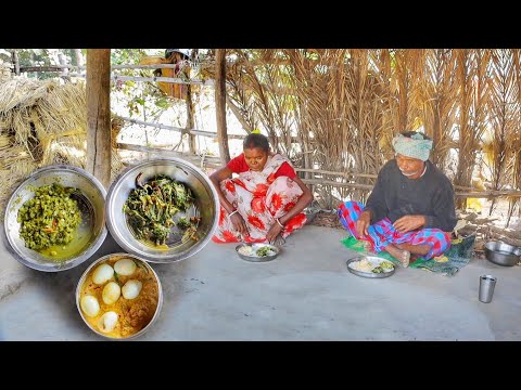 Santali tribe poor family cooking and eating Egg vapa, shak vaji and karela vorta