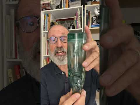 The story behind the beautiful green thick glass bottle that sits on my bookshelf.