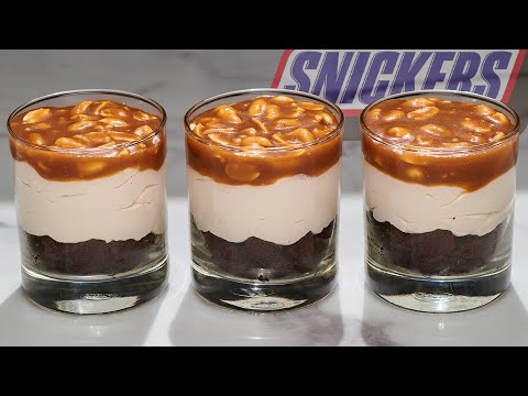 Amazing Snickers dessert. Brownie chocolate mousse trifles in cups.