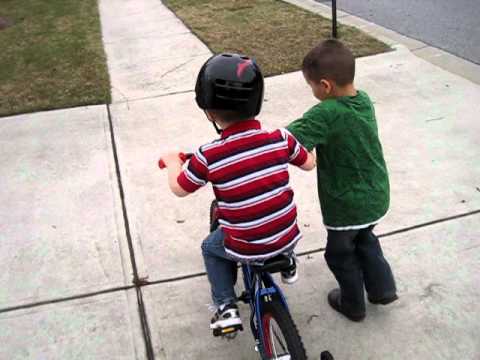 Ryker and Austin Riding his new bike.AVI