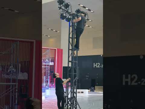 Installing high-intensity lights in preparation for Fair Opening