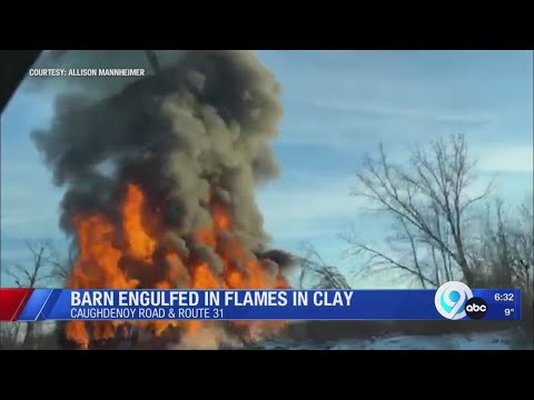 Barn engulfed in flames in Clay