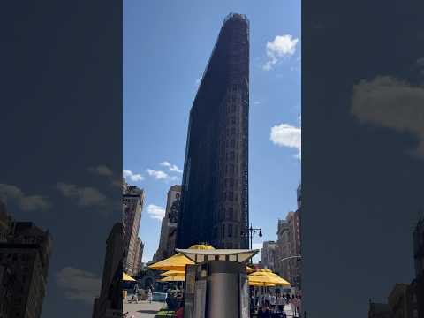 View of the iconic Flatiron Building with scaffolding for restoration in Manhattan, New York City!